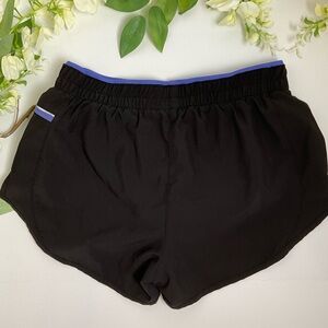 ASICS Women’s Black & Purple Lightweight Sport Shorts W/ Zip pocket SZ S Used